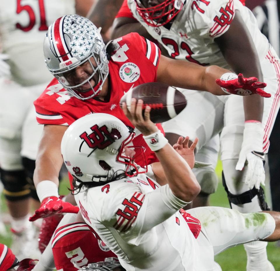 Sat., Jan. 1, 2022; Pasadena, California, USA; Ohio State Buckeyes defensive lineman J.T. Tuimoloau (44) tackles Utah Utes quarterback Cameron Rising (7) during the fourth quarter of the 108th Rose Bowl Game between the Ohio State Buckeyes and the Utah Utes at the Rose Bowl. 