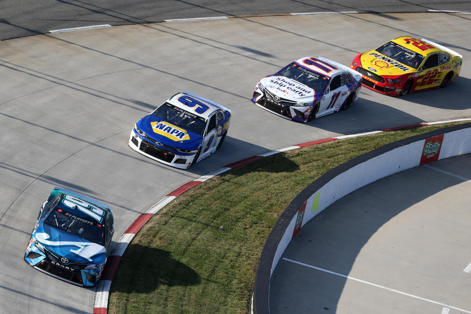 MARTINSVILLE, VIRGINIA - NOVEMBER 01: Martin Truex Jr., driver of the #19 Auto-Owners Insurance Toyota, Chase Elliott, driver of the #9 NAPA Auto Parts Chevrolet, Denny Hamlin, driver of the #11 FedEx Ground Toyota, and Joey Logano, driver of the #22 Shell Pennzoil Ford, race during the NASCAR Cup Series Xfinity 500 at Martinsville Speedway on November 01, 2020 in Martinsville, Virginia. (Photo by Brian Lawdermilk/Getty Images)