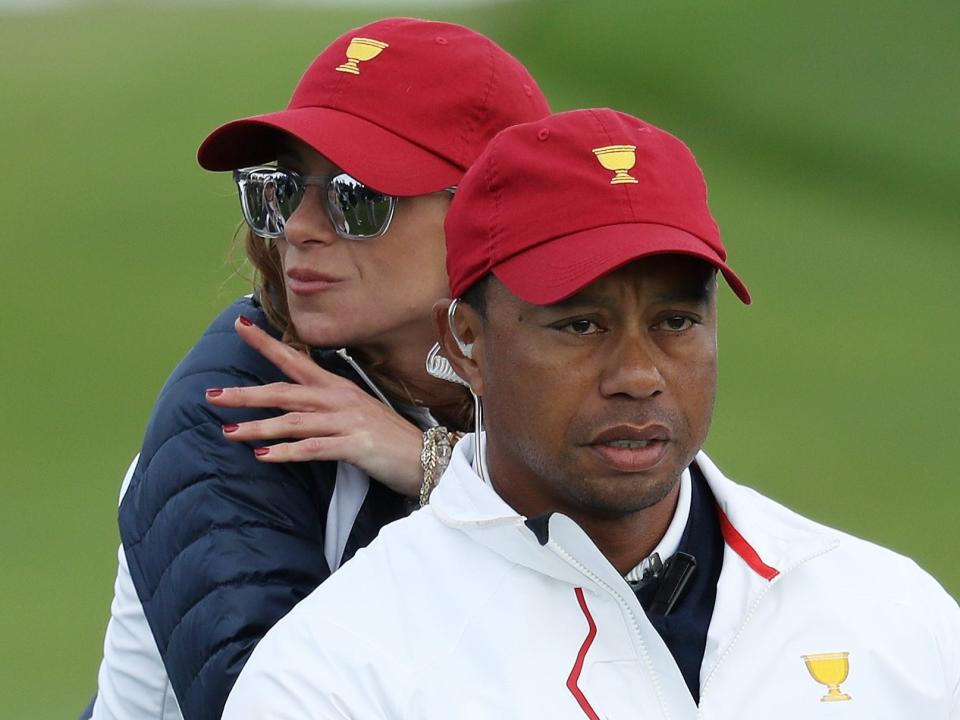 Tiger Woods and his girlfriend Erica Herman watch the 2017 Presidents Cup.