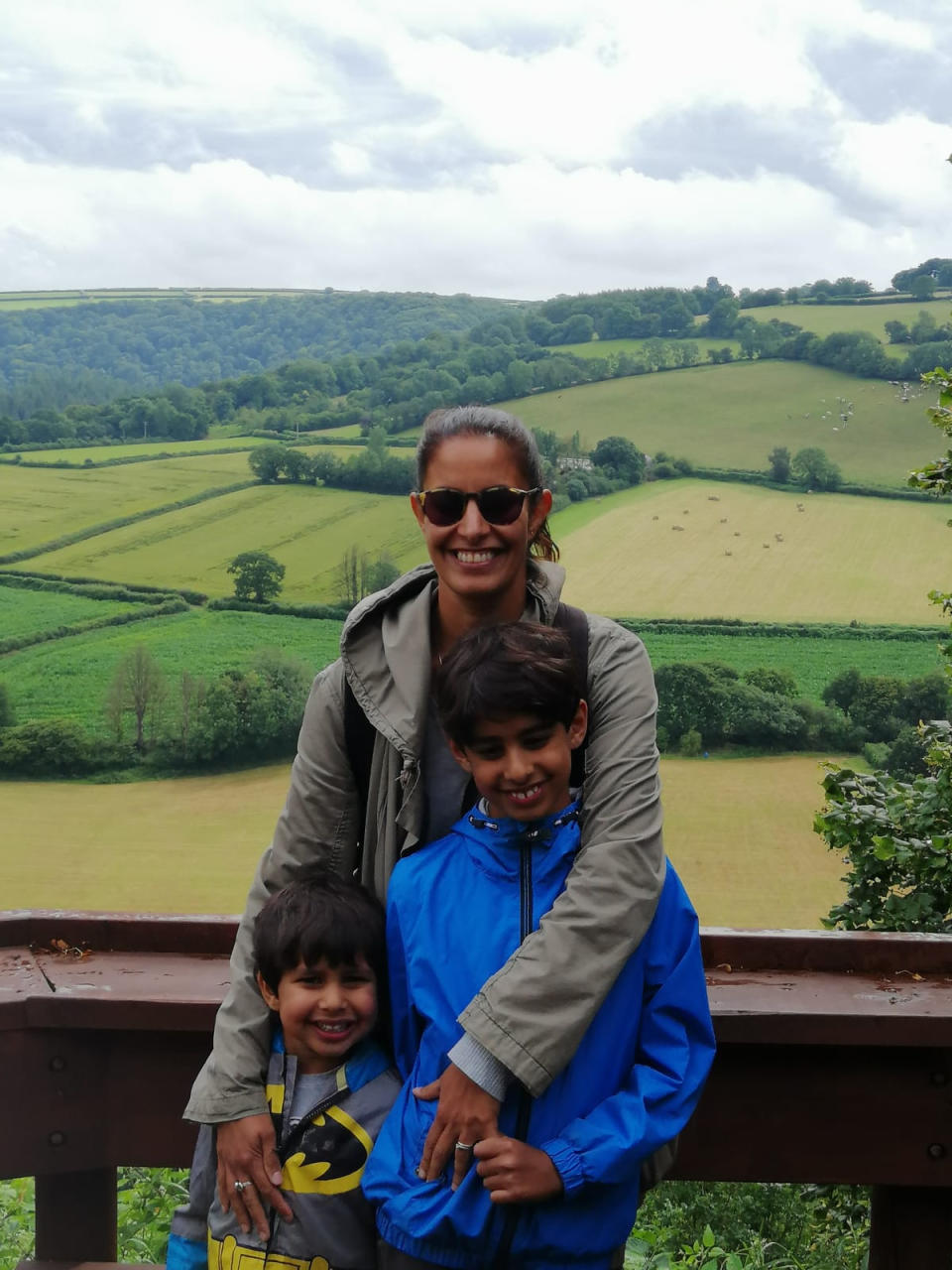 Sharon Dhillon, pictured with her two sons, endured various painful symptoms during IVF. (Supplied)