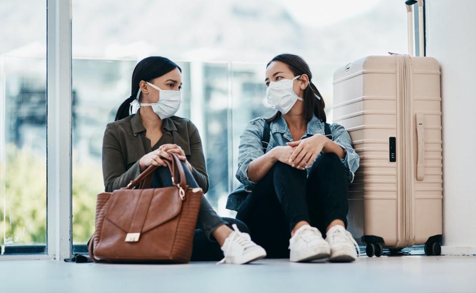 <span class="caption">Wearing face masks is still important, especially when traveling.</span> <span class="attribution"><a class="link " href="https://www.gettyimages.com/detail/photo/it-took-distance-to-connect-us-royalty-free-image/1216009023?adppopup=true" rel="nofollow noopener" target="_blank" data-ylk="slk:Getty Images / PeopleImages;elm:context_link;itc:0;sec:content-canvas">Getty Images / PeopleImages</a></span>