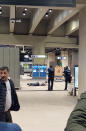 In this image made from video, police surround a man on the floor of a metro station near EU headquarters in Brussels, Monday, Jan. 30, 2023. News reports on Monday said that one man was injured in a knife incident around the European Union's headquarters in Brussels before one suspect was detained. (Zoran Popovici via AP)