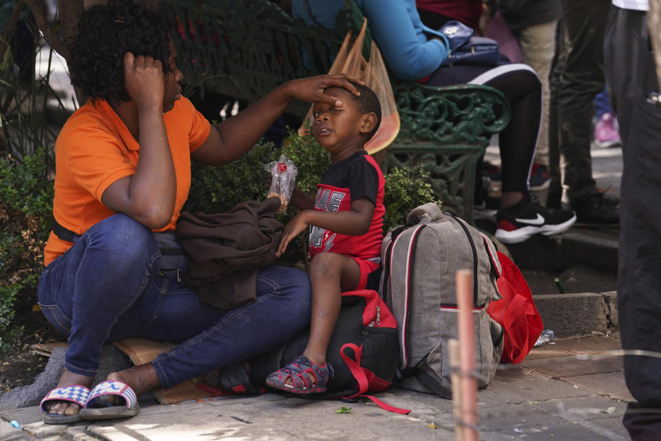 Haitian migrant children arrive with their parents at the Mexican Commission for Refugee Assistance, COMAR, to request refuge in Mexico City, Wednesday, Sept. 22, 2021. (AP Photo / Marco Ugarte)