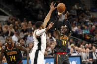 Nov 20, 2017; San Antonio, TX, USA; Atlanta Hawks point guard Dennis Schroder (17) shoots the ball over San Antonio Spurs power forward LaMarcus Aldridge (12) during the first half at AT&T Center. Soobum Im-USA TODAY Sports