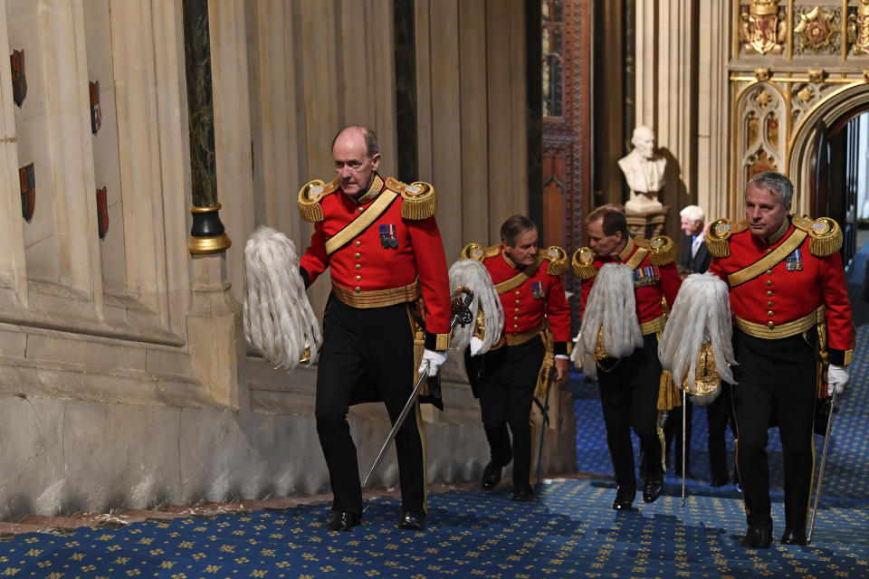 Gentlemen at Arms climb the Norman Porch stairs to attend the official State Opening of Parliament in London, Monday Oct. 14, 2019. (Paul Ellis/Pool via AP)