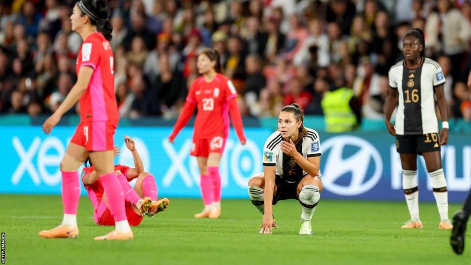 German players look dejected after crashing out at the group stages of the Women's World Cup