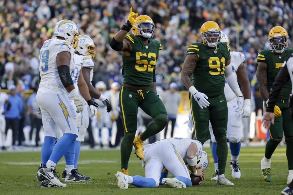 Green Bay Packers linebacker Rashan Gary (52) reacts after sacking Los Angeles Chargers quarterback Justin Herbert (10) during the second half of an NFL football game, Sunday, Nov. 19, 2023, in Green Bay, Wis. The Packers won 23-20. (AP Photo/Mike Roemer)