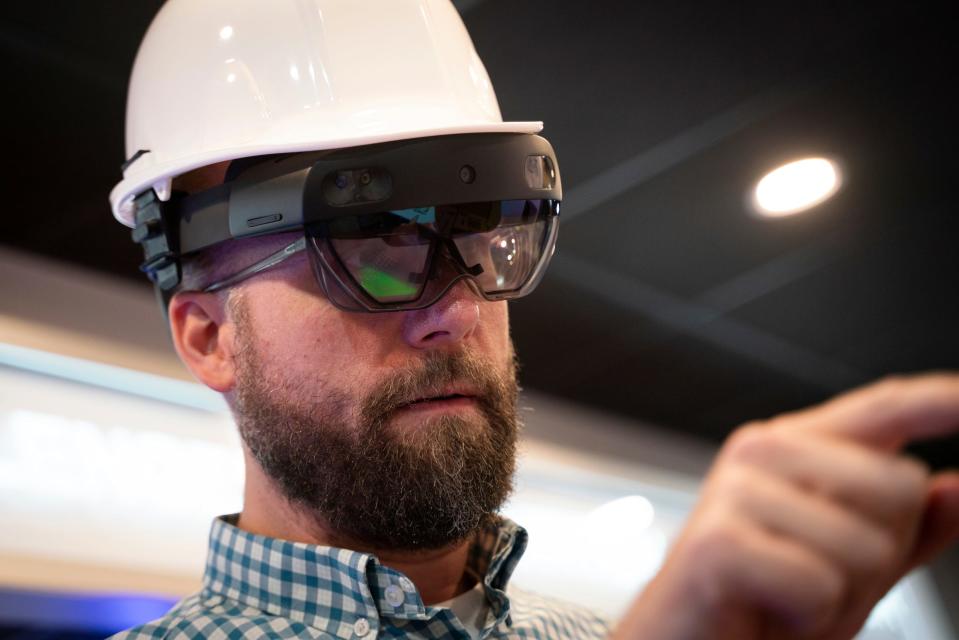 Steve Purchase, 40, communications director, wears an augmented reality headset part of a interactive exhibit on wheels commissioned by the Michigan Regional Council of Carpenters and Millwrights to spread the word about skilled trades at Creative Solutions Group in Clawson on Thursday, Aug. 31, 2023.