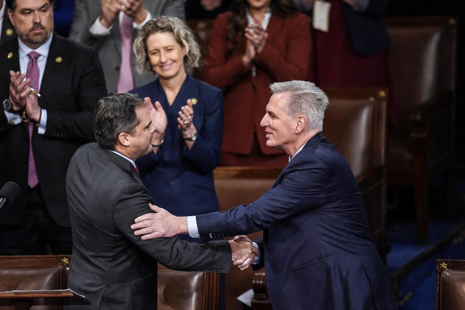 Image: Rep. Mike Garcia, R-Calif., left, shakes hands with Rep. Kevin McCarthy, R-Calif., after nominating him for the twelfth round of voting in the House chamber as the House meets for the fourth day to elect a speaker and convene the 118th Congress on Jan. 6, 2023. (Alex Brandon / AP)