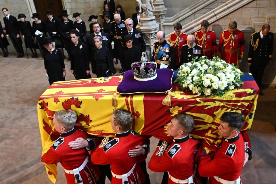 Pallbearers from The Queen's Company, 1st Battalion Grenadier Guards carry the coffin of Queen Elizabeth II (AFP via Getty Images)