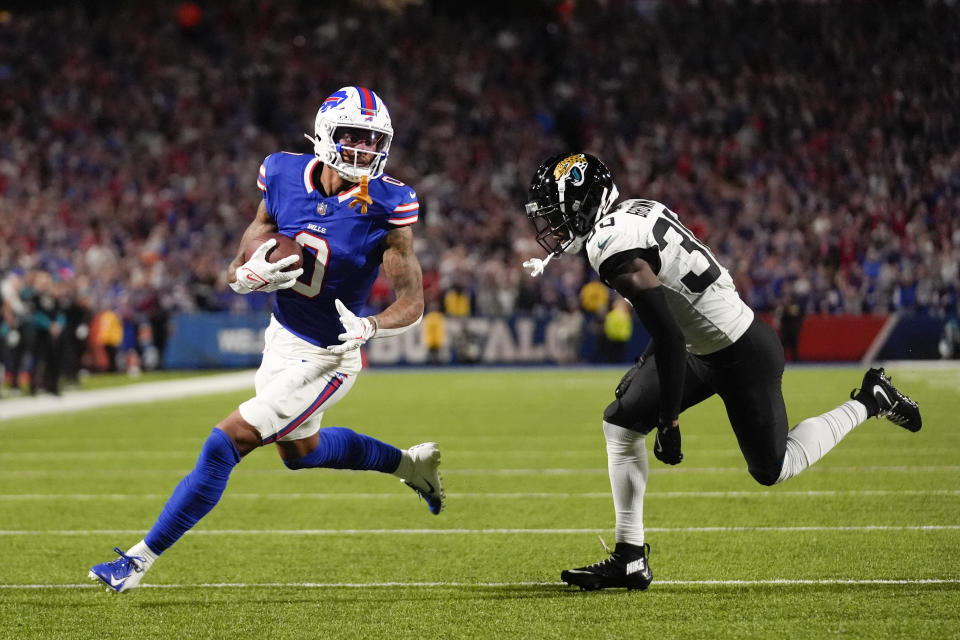 Buffalo Bills wide receiver Keon Coleman, left, scores a touchdown past Jacksonville Jaguars cornerback Montaric Brown during the first half of an NFL football game Monday, Sept. 23, 2024, in Orchard Park, NY. (AP Photo/Steven Senne)