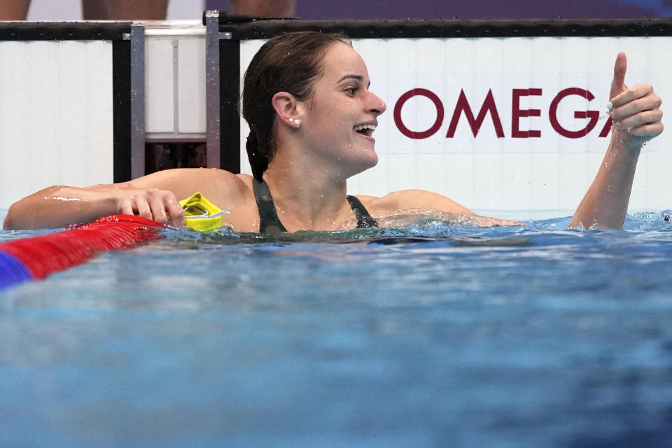 Kaylee McKeown of Australia waves after winning the final of the women's 100-meter backstroke at the 2020 Summer Olympics, Tuesday, July 27, 2021, in Tokyo, Japan. (AP Photo/Matthias Schrader)