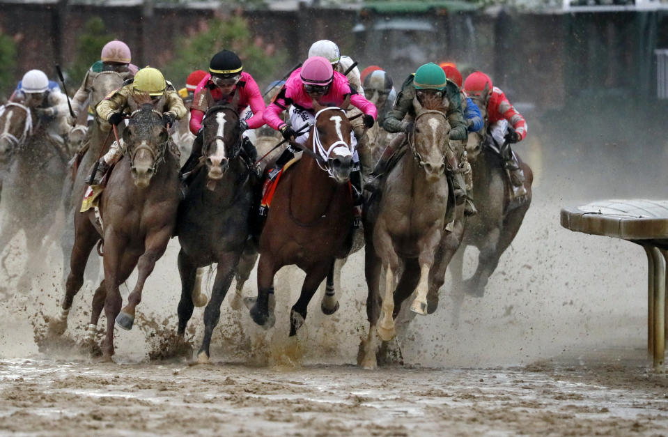 FILE - From front left, Country House, ridden by Flavien Prat, War of Will, ridden by Tyler Gaffalione, Maximum Security, ridden by Luis Saez, and Code of Honor, ridden by John Velazquez, round the far turn during the 145th running of the Kentucky Derby horse race at Churchill Downs in Louisville, Ky., Saturday, May 4, 2019. At 65-1 odds, Country House became the second-highest priced winner in Derby history in a highly unusual way. (AP Photo/John Minchillo, File)