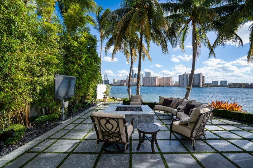 The outdoor space comes with water views. Become Legendary / ONE Sotheby's International Realty