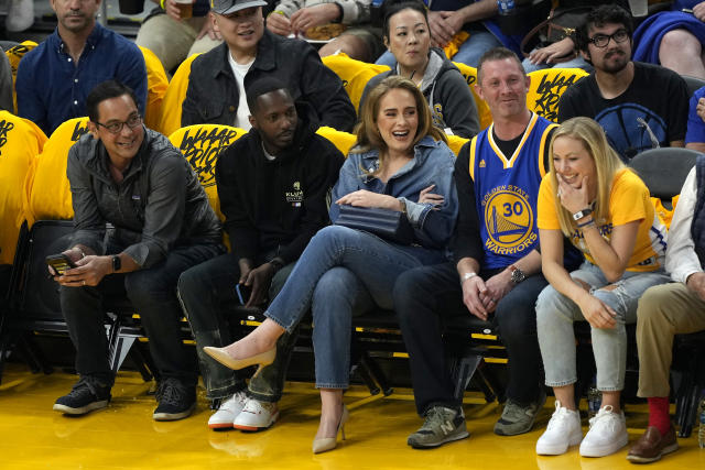 Adele wows in double denim and heels for date night at basketball game