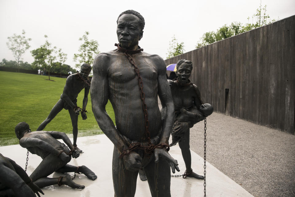 A sculpture commemorating the slave trade greets visitors at the entrance National Memorial For Peace And Justice on April 26, 2018 in Montgomery, Alabama. (Photo by Bob Miller/Getty Images)