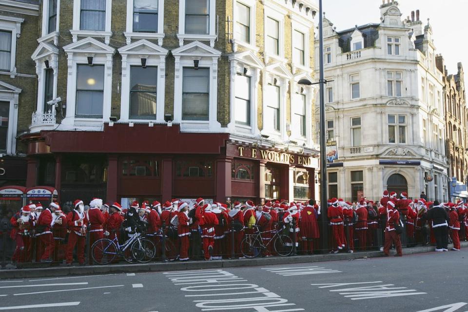 A flash mob of revellers dressed as Father Christmas are photographed in London’s Camden Town in 2006 (Getty)