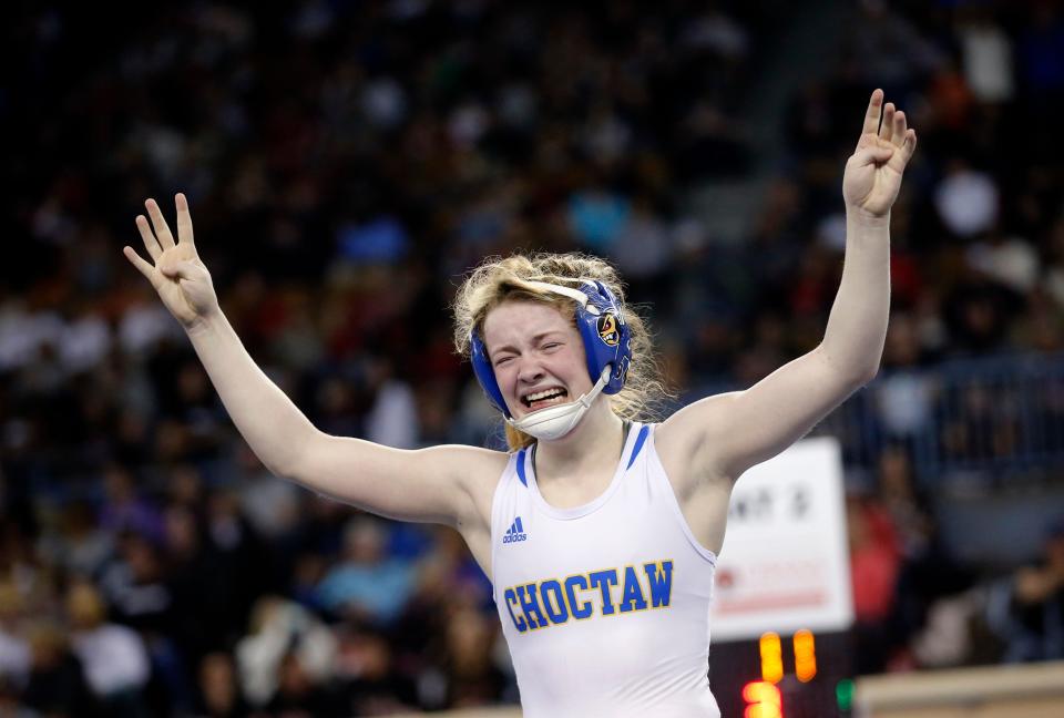 Choctaw's Peyton Hand celebrates after beating Coweta's Aiyana Perkins in the 115-pound match during the state wrestling tournament finals Saturday at State Fair Arena.
