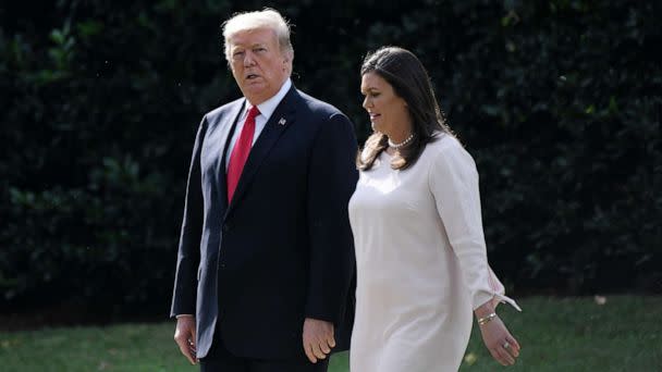 PHOTO: President Donald Trump walks with White House Press Secretary Sarah Huckabee Sanders as they leave the White House to board Marine One, Oct. 9, 2018, in Washington. (Olivier Douliery/AFP via Getty Images)