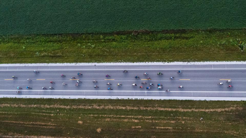 Bikers make their way out of Ames on Wednesday morning, Day 4 of RAGBRAI, on their way to Des Moines.