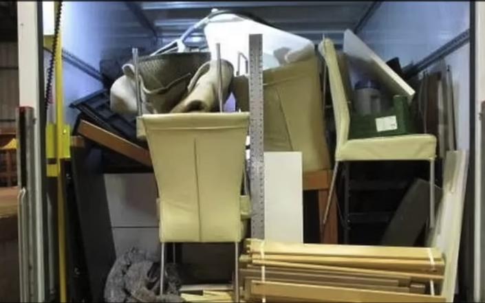 Furniture piled up inside one of the vans - WMPS