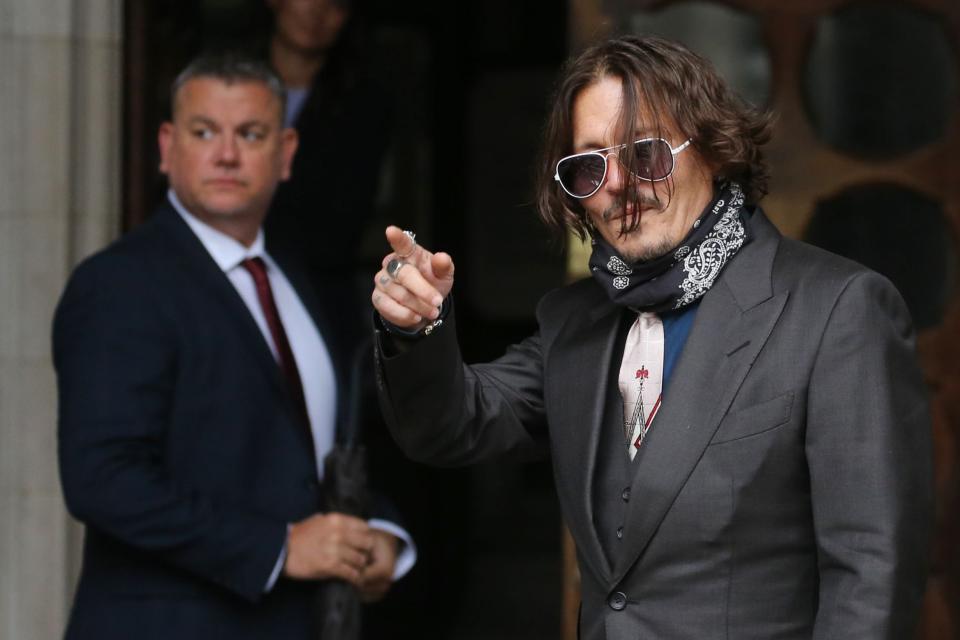 Mr Depp is suing the publisher of The Sun for libel (AFP via Getty Images)