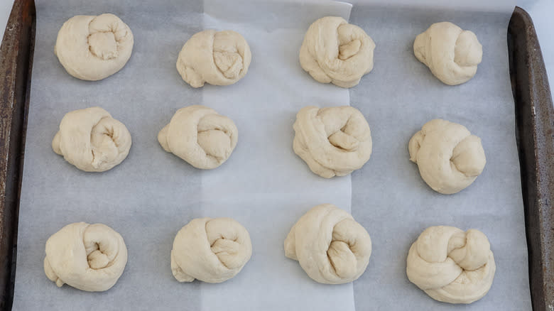 unbaked garlic knots on baking sheet