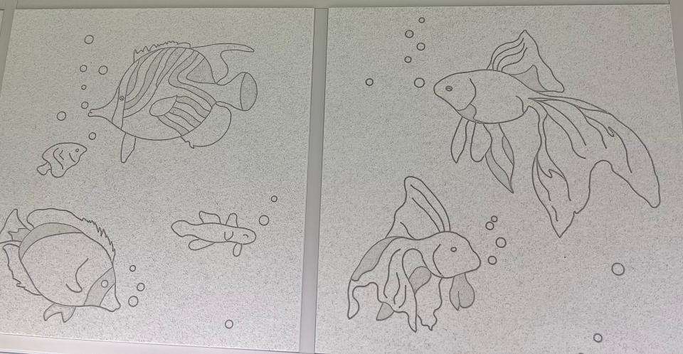 The ceilings inside the children's room at the HCA Palms West pediatrics emergency center are engraved with drawings of fish swimming.