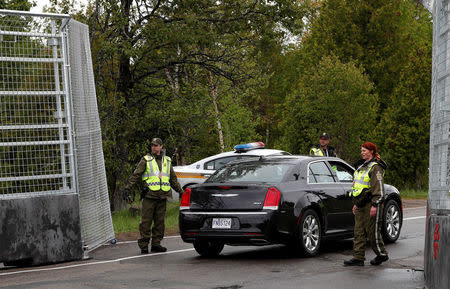 Canadian police check a car next to the red zone security perimeter around the Manoir Richelieu ahead of G7 Summit in La Malbaie, Canada June 5, 2018. REUTERS/Yves Herman