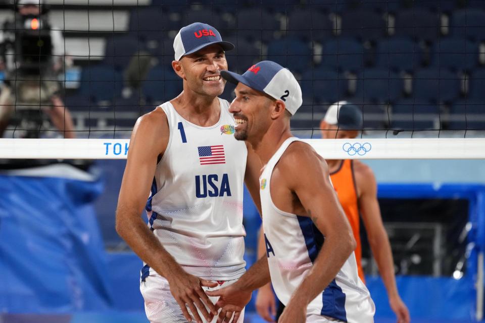 Phil Dalhausser and Nick Lucena (USA) celebrate during the Tokyo 2020 Olympic Summer Games at Shiokaze Park.