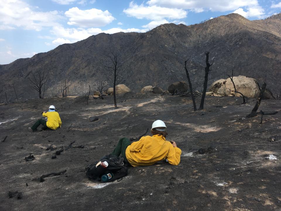 University of Arizona graduate student Alexander Gorr, right, and Ann Youberg measure soil infiltration properties to assess runoff potential in an area burned by the 2021 Telegraph Fire near Globe.