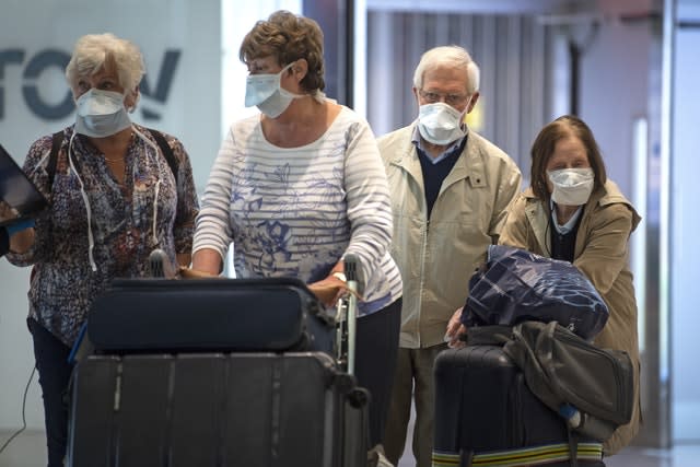 Passengers walk through arrivals in Terminal 2 at Heathrow Airport (Victoria Jones/PA)