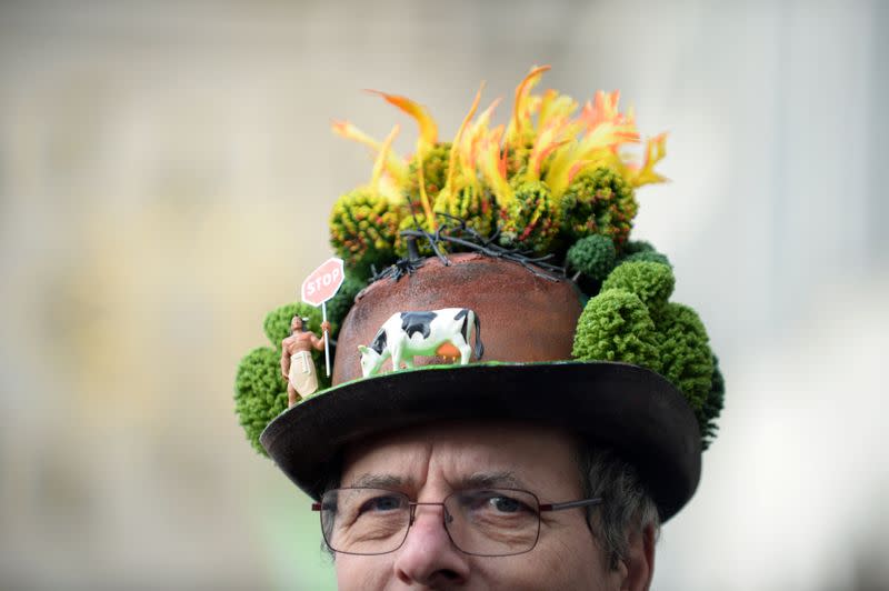 A man attends a climate change protest in Brussels