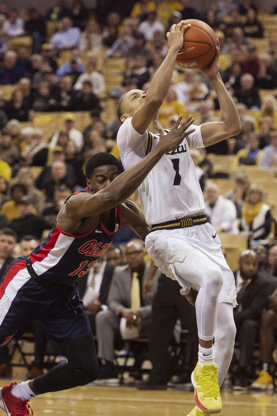 Missouri's Xavier Pinson, right, is fouled by Mississippi's Bryce Williams, left, as he shoots during the second half of an NCAA college basketball game Tuesday, Feb. 18, 2020, in Columbia, Mo. Missouri won 71-68.(AP Photo/L.G. Patterson)