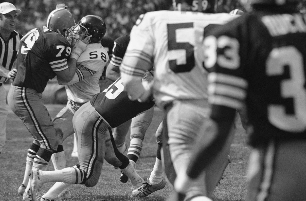 Browns offensive tackle Gerry Sullivan (79) and Steelers linebacker Jack Lambert (58) tangle as a battle breaks out in the second quarter, Oct. 5, 1975 in Cleveland. Two players were tossed out of the game. The Steelers won 42-6.