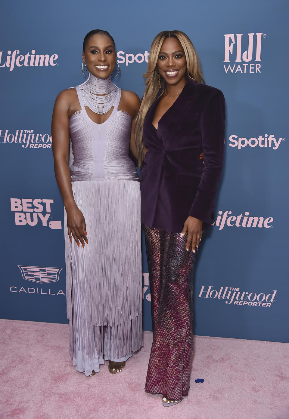 Issa Rae, left, and Yvonne Orji arrive at The Hollywood Reporter's Women in Entertainment Gala on Wednesday, Dec. 7, 2022, at Fairmont Century Plaza in Los Angeles. (Photo by Jordan Strauss/Invision/AP)