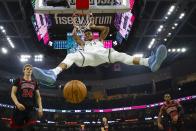 Milwaukee Bucks' Giannis Antetokounmpo dunks during the first half of an NBA basketball game against the Chicago Bulls Thursday, Nov. 14, 2019, in Milwaukee. (AP Photo/Morry Gash)