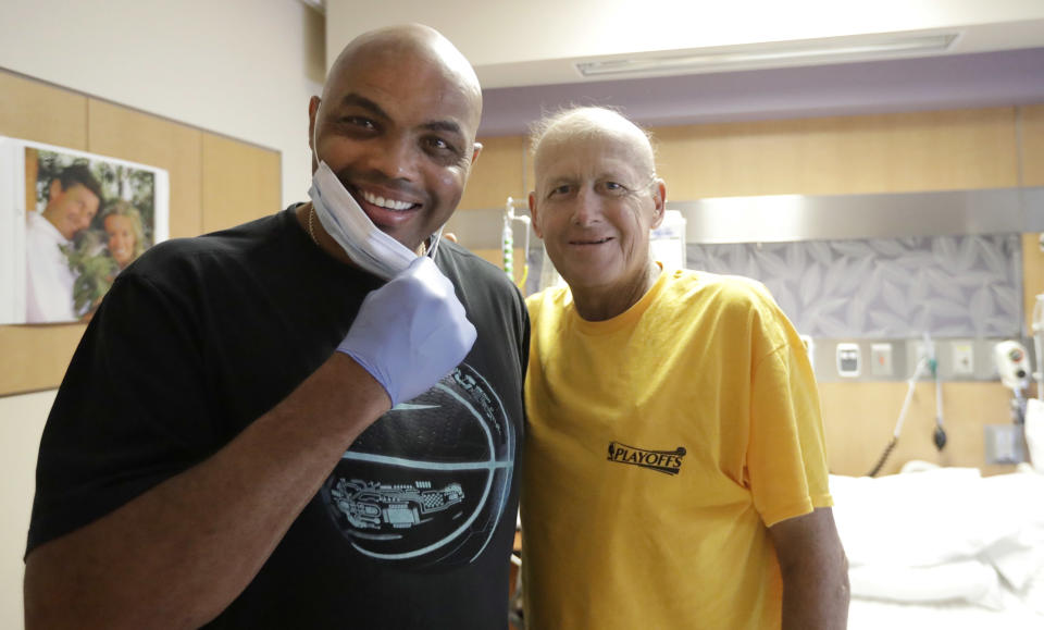 FILE - In this Aug. 31, 2016, file photo, NBA Hall of Fame member and TNT colleague Charles Barkley, left, poses with longtime NBA sideline reporter Craig Sager while visiting Sager at MD Anderson Cancer Center in Houston. Sager, famous for his flashy suits and probing questions, has died after a battle with cancer, Turner Sports announced Thursday, Dec. 15, 2016. He was 65. (AP Photo/David J. Phillip, File)
