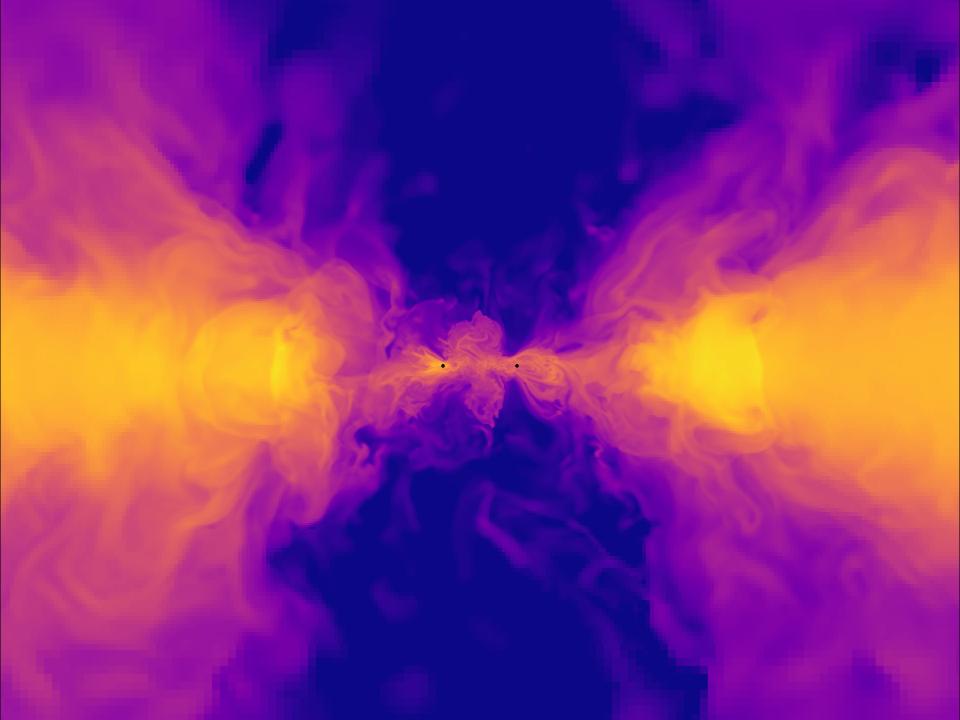 simulation shows two black spots approaching each other with clouds of yellow material fanning out behind them to the left and right