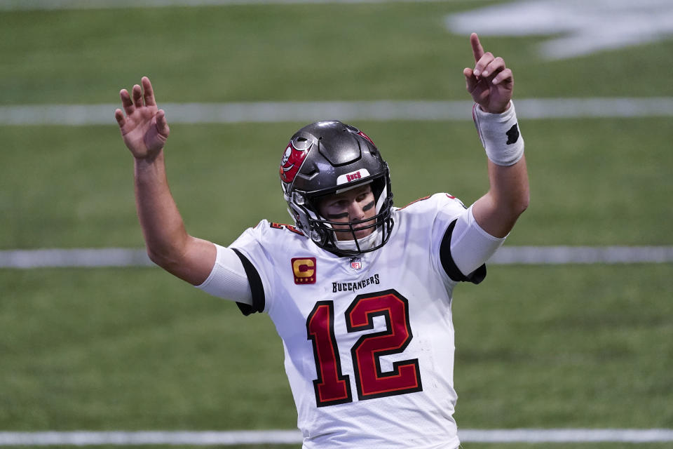 Tampa Bay Buccaneers quarterback Tom Brady (12) reacts after a Tampa Bay Buccaneers touchdown against the Atlanta Falcons during the second half of an NFL football game, Sunday, Dec. 20, 2020, in Atlanta. (AP Photo/John Bazemore)