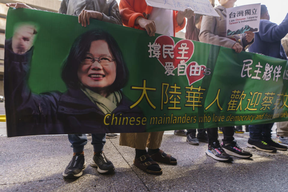 Supporters of Taiwan's President Tsai Ing-wen await her arrival outside The Westin Bonaventure Hotel in Los Angeles Tuesday, April 4, 2023. (AP Photo/Damian Dovarganes)