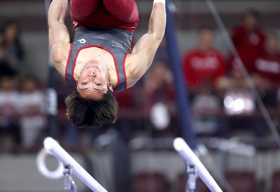 Oklahoma's Colin Flores dismounts the parallel bars during the University of Oklahoma Sooner men's gymnastic meet with Ohio State and Arizona State at McCasland Field House in Norman, Okla., Saturday, Feb. 3, 2024.