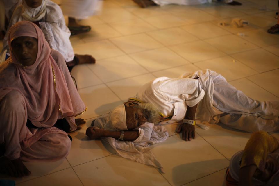 A Muslim pilgrim rests outside the Grand Mosque in the holy city of Mecca ahead of the annual Haj pilgrimage