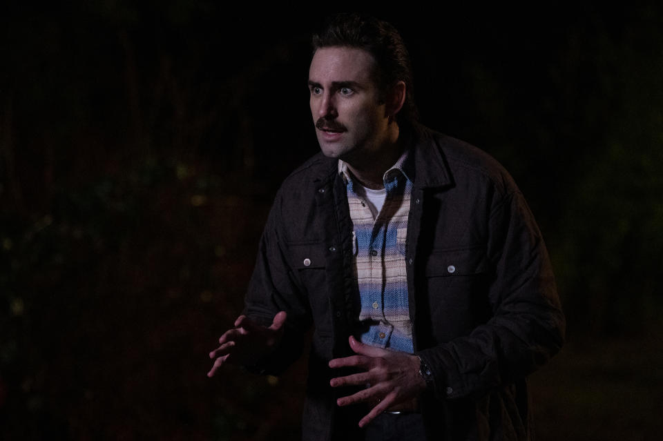 A mustached man in a plaid shirt and jacket, looking worried; still from "Yellowjackets"