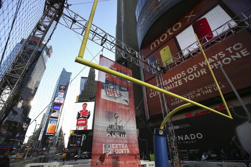 A field goal stands at an event space on Super Bowl Boulevard in Times Square before Indianapolis Colts placekicker Adam Vinatieri kicks a football to benefit NFL Play60 with a $10,000 donation from NFL Extra Points issued by Barclaycard, Wednesday, Jan. 29, 2014, in New York. (John Minchillo/AP Images for Barclaycard)