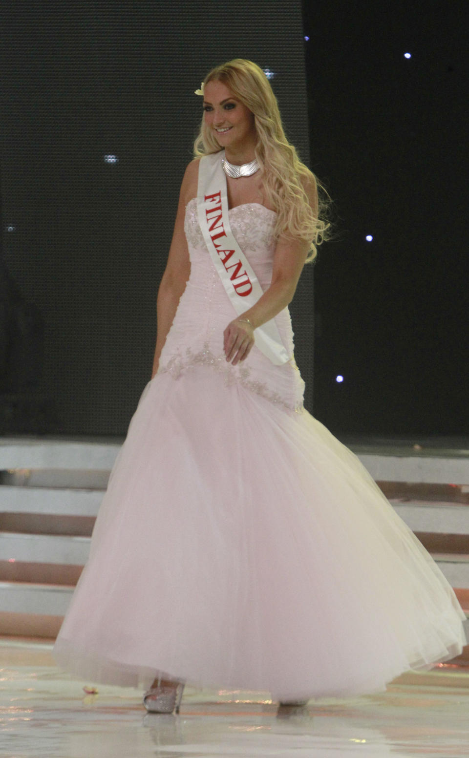 Miss Finland Maija Kerisalmi walks on stage during the opening of the 63rd Miss World Pageant ceremony in Nusa Dua, Bali, Indonesia on Sunday, Sept. 8, 2013. (AP Photo/Firdia Lisnawati)