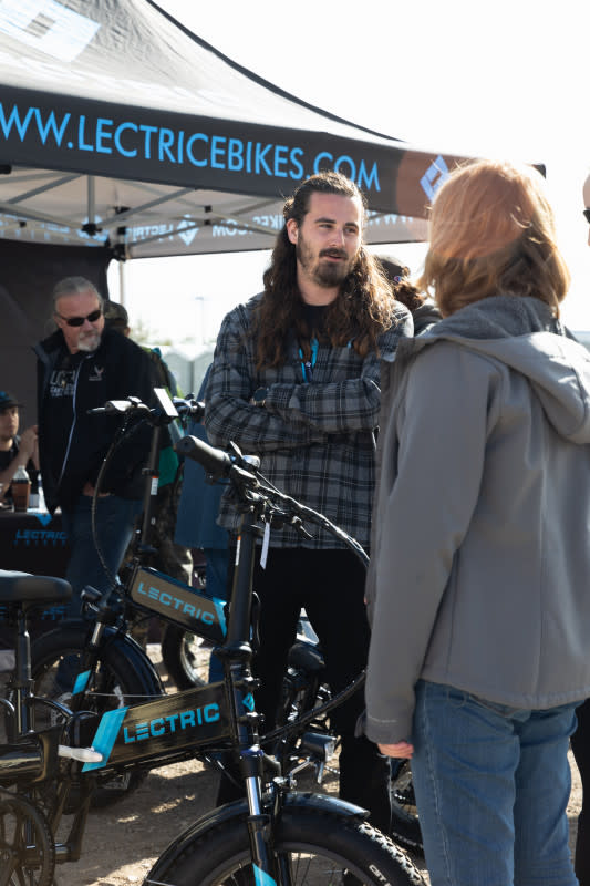 The approachable Levi Conlow deep in conversation with customers.<p>Lectric E-bikes</p>