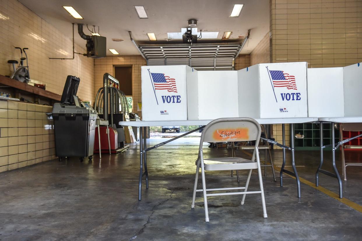 An empty voting booth is seen at Fire Station 7 for the midterm elections in Jackson, Miss., Tuesday, November 8, 2022.