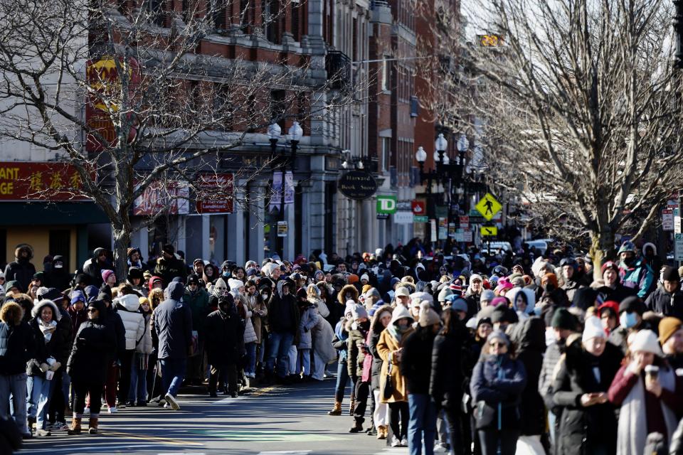 People line the route for Harvard's Hasty Pudding Theatricals Woman of the Year parade honoring Jennifer Coolidge, Saturday, Feb. 4, 2023, in Cambridge, Mass. (AP Photo/Michael Dwyer)