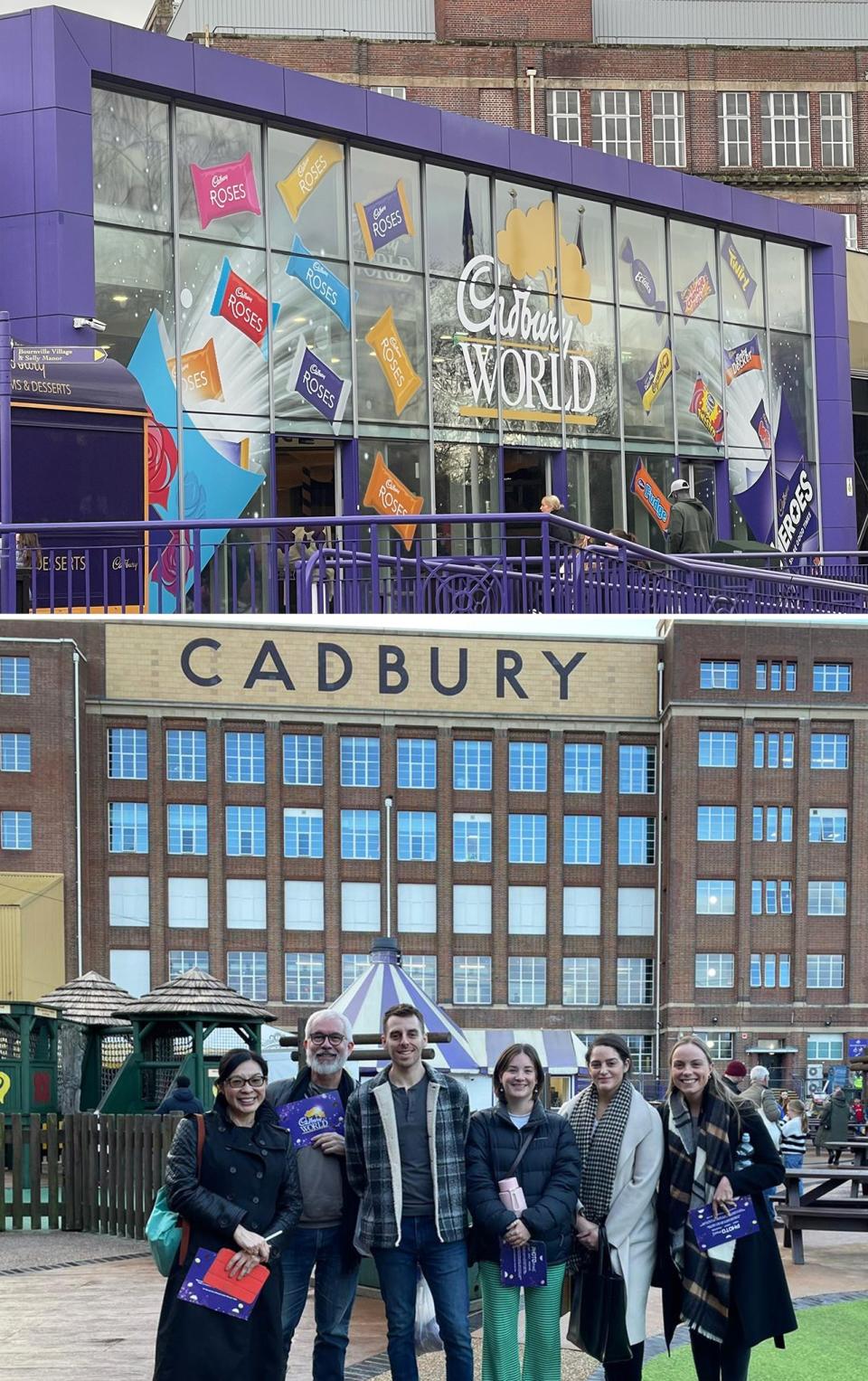 Group of visitors standing in front of the Cadbury World entrance, smiling